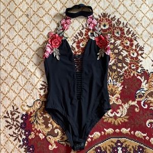 Embroidered body suit